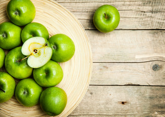 fruit. apples in a bowl on wooden background
