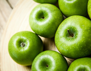 fruit. apples in a bowl on wooden background