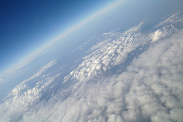 clouds and blue sky seen from plane