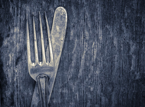 Vintage Silverware On Rustic Wooden Background