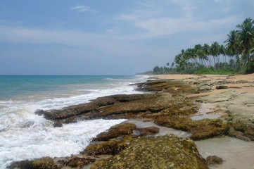 Fototapeta na wymiar Stones on the idyllic beach in Sri Lanka.