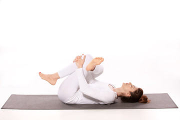 Woman practicing yoga in studio