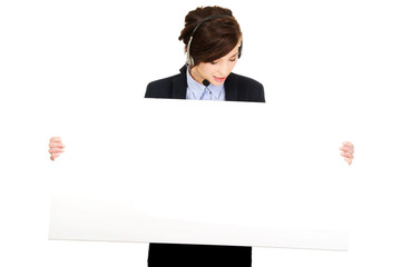 Call center woman holding empty banner.