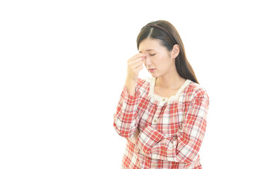 体調不良の女性