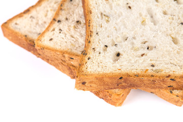 selective focus closeup cereal and black sesame bread on white b
