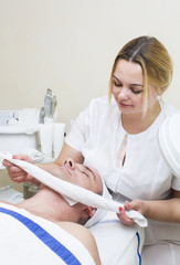 man in a beauty salon facial and massage