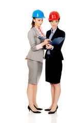 Architect woman signing contract.