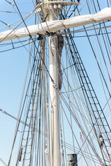 Fototapeta premium sailboat masts, riggin and rolled up sails