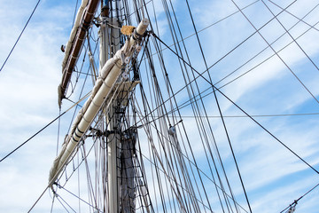 sailboat masts, rigging and rolled up sails