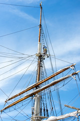 Fototapeta premium sailboat masts, rigging and rolled up sails