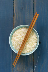 rice in blue bowl in blue background