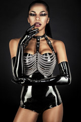 Portrait of sexy woman in black latex outfit