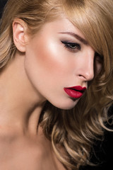 Fototapeta na wymiar Beautiful young model with red lips and perfect makeup