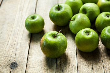 fruit. Ripe green apples on wooden background