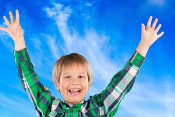 Fingers. Happy little child with smiley faces painted on his