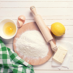 Ingredients for dough on wooden board