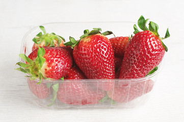 Fresh strawberries in plastic packing