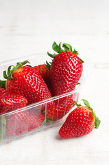 Ripe strawberries in plastic packing