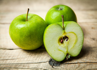 fruit. Ripe green apples on wooden background