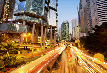 Fototapeta na wymiar traffic light trails and office buildings in modern city