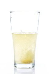 effervescent teblet in glass  on White background