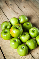 fruit. Ripe green apples on wooden background