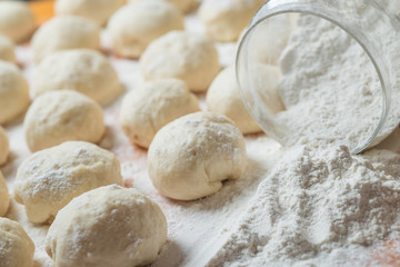 Fototapeta na wymiar Small balls of fresh homemade dough