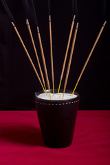 aromatic sticks in black cup