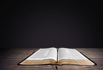 Bible. Open Bible with Creation Sky