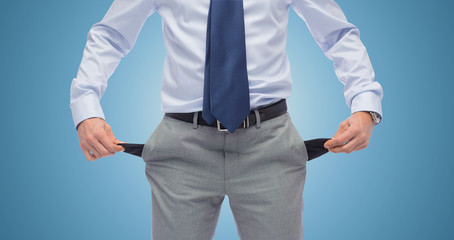 close up of businessman showing empty pockets