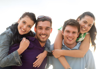group of happy friends having fun outdoors