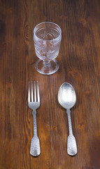 Spoon, fork and glass