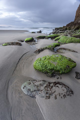 Rocks lead way to Pacific Ocean.