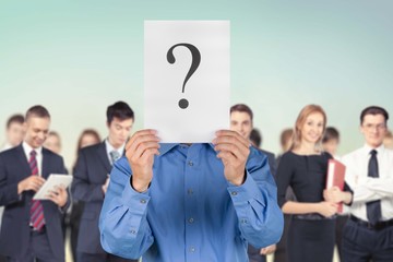 Question Mark. Colleagues holding question mark signs in front
