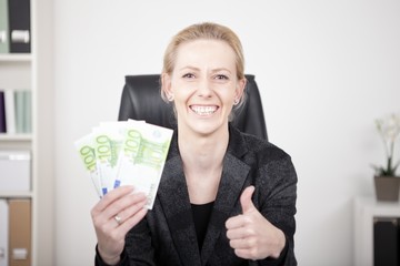 Happy Businesswoman in Thumbs Up Holding Cash