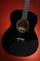 Acoustic Guitar Fretboard in Black on a red background