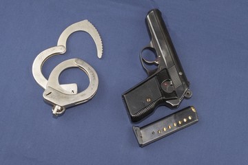 gun, magazine and police handcuffs