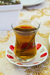 apple Turkish tea in a traditional cup in a cafe