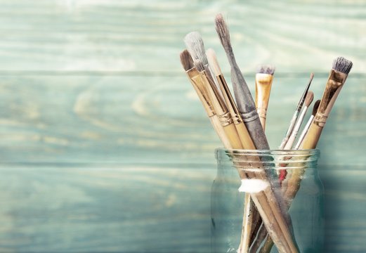 Paint. Photo of paint brushes in a jar