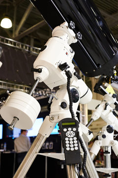 Big telescope with reflector and control panel