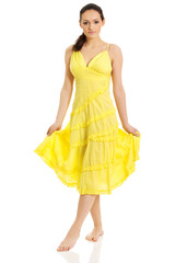 Beautiful female model in yellow dress.