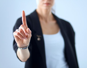 Woman touching an imaginary screen with her finger