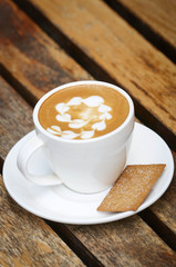 Cup of coffee on wooden table