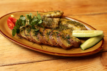 Fried fillet of sea bass on the plate
