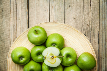 fruit. apples in a bowl on wooden background