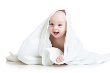 Adorable baby looking out under towel
