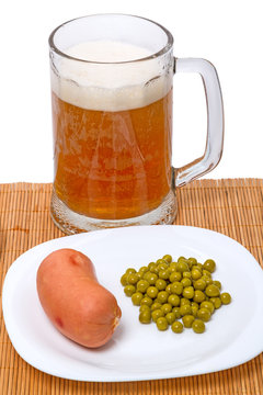 Beer with sausage and green peas