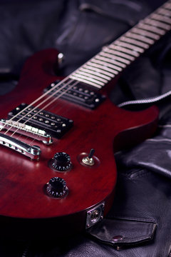 Electric guitar on black leather