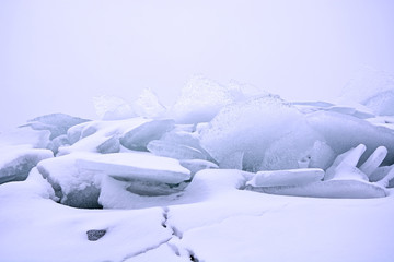 Fototapeta na wymiar Hummock on the frozen sea shore at winter season