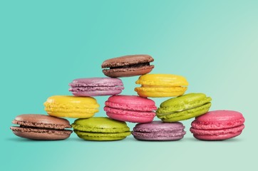 Cakes. Pyramid of pastel macaroons on white background